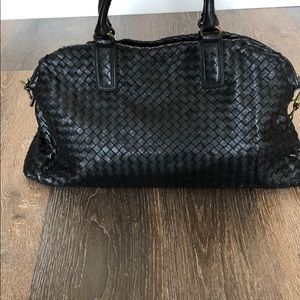 Black woven leather small duffel bag